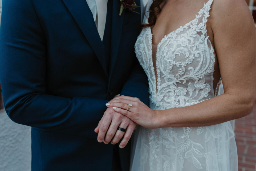 bride and groom holding hands