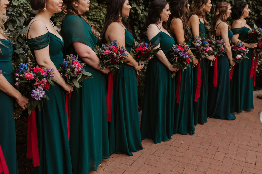 bridesmaids wearing emerald green dresses